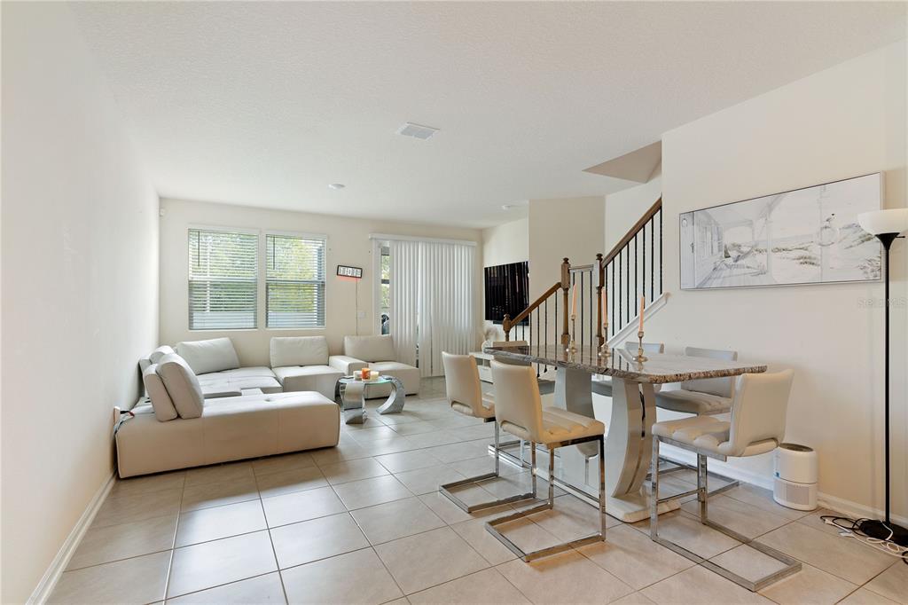 117 Redbud Road Palm Coast, FL 32137 - Photo 4 of 13 a living room with furniture and a table