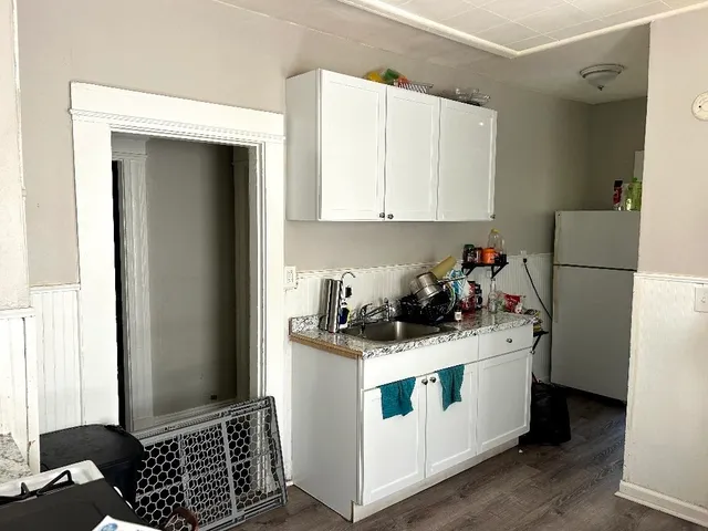 a kitchen with a stove and a refrigerator