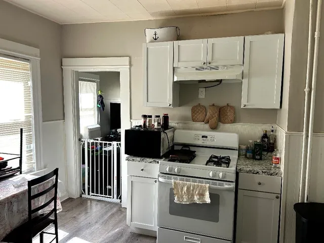 a kitchen with a stove and a refrigerator