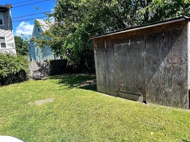 a backyard of a house with lots of green space