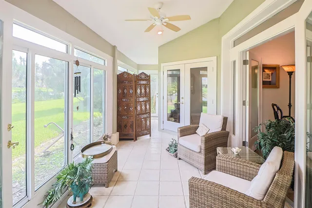 a kitchen with stainless steel appliances granite countertop a refrigerator a stove and a sink with wooden floor