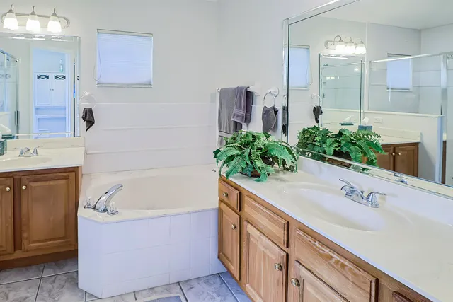 a bedroom with a bed and a chair