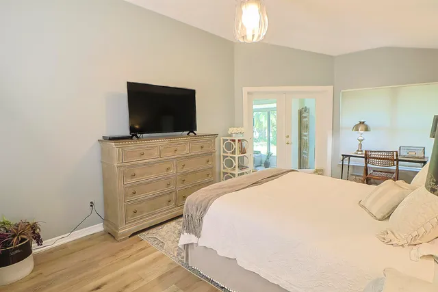 a view of a livingroom with furniture and a window
