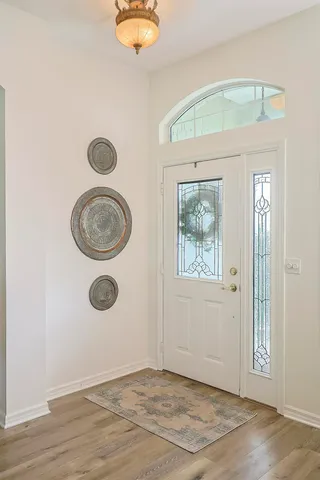 an empty room with a stove and a window