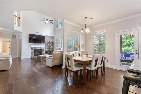 a kitchen with stainless steel appliances granite countertop a sink stove and cabinets