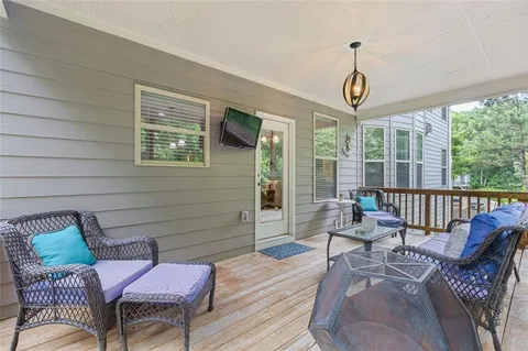 a bathroom with a tub a window and a shower