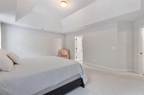 a bedroom with a bed and a cabinets