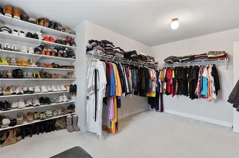 a view of backyard with table and chairs and garden