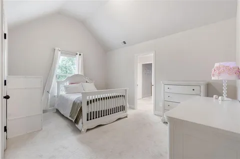 a view of a patio with table and chairs and potted plants