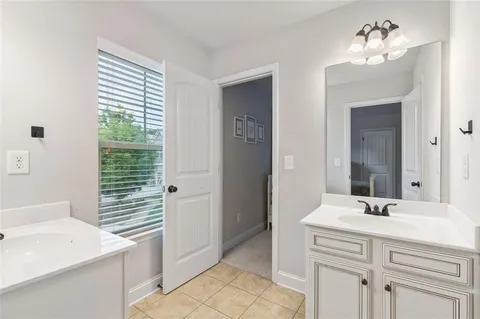 an aerial view of a house with a yard and trees