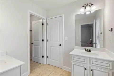 an aerial view of a house with a yard basket ball court and outdoor seating