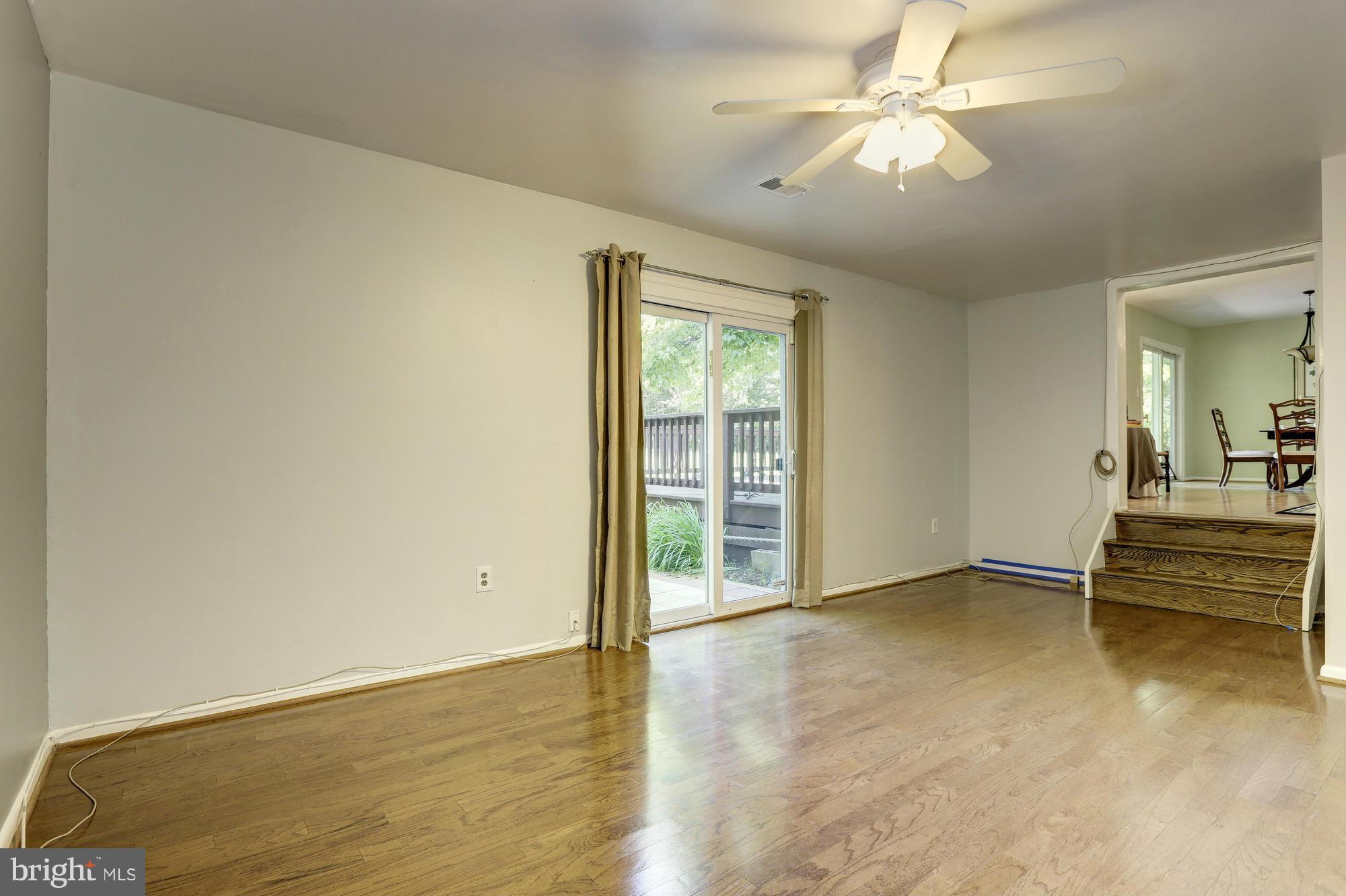 12906 Buccaneer Road Silver Spring, MD 20904 - Photo 13 of 30 wooden floor in an empty room with a window