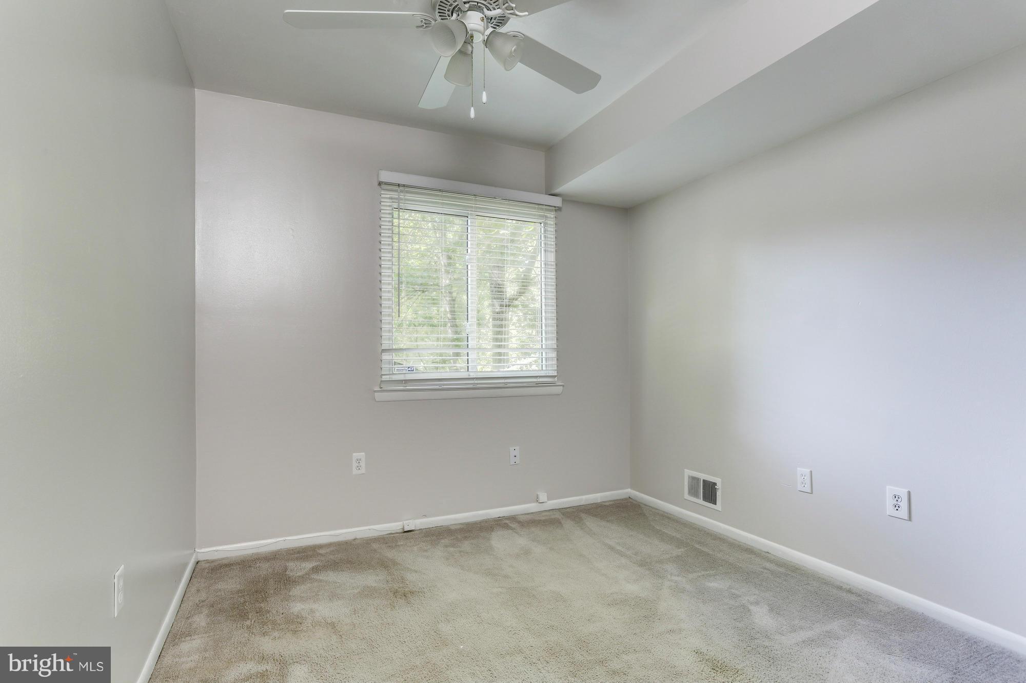 12906 Buccaneer Road Silver Spring, MD 20904 - Photo 14 of 30 an empty room with a window and a fan
