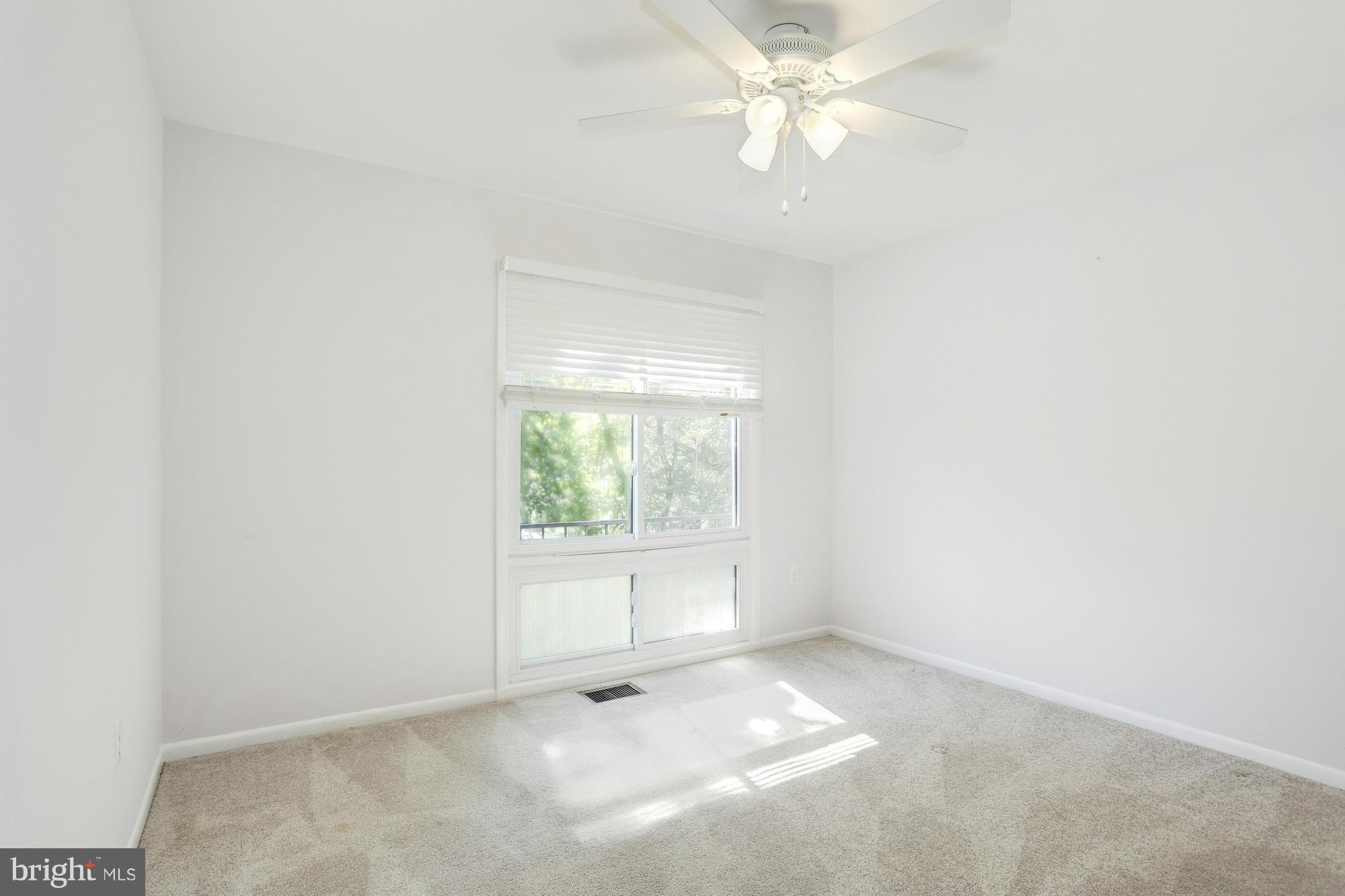 12906 Buccaneer Road Silver Spring, MD 20904 - Photo 18 of 30 an empty room with a window and a fan