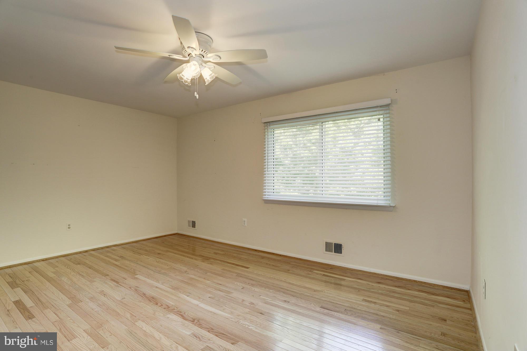 12906 Buccaneer Road Silver Spring, MD 20904 - Photo 22 of 30 wooden floor in an empty room with a window
