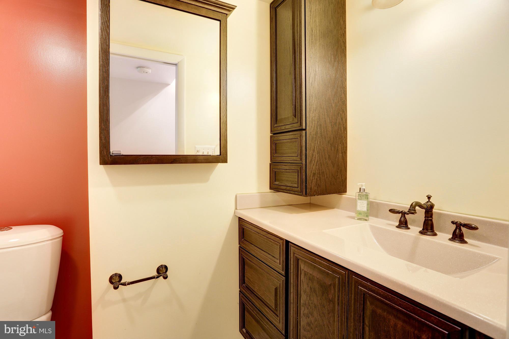 12906 Buccaneer Road Silver Spring, MD 20904 - Photo 24 of 30 a bathroom with a sink and a mirror