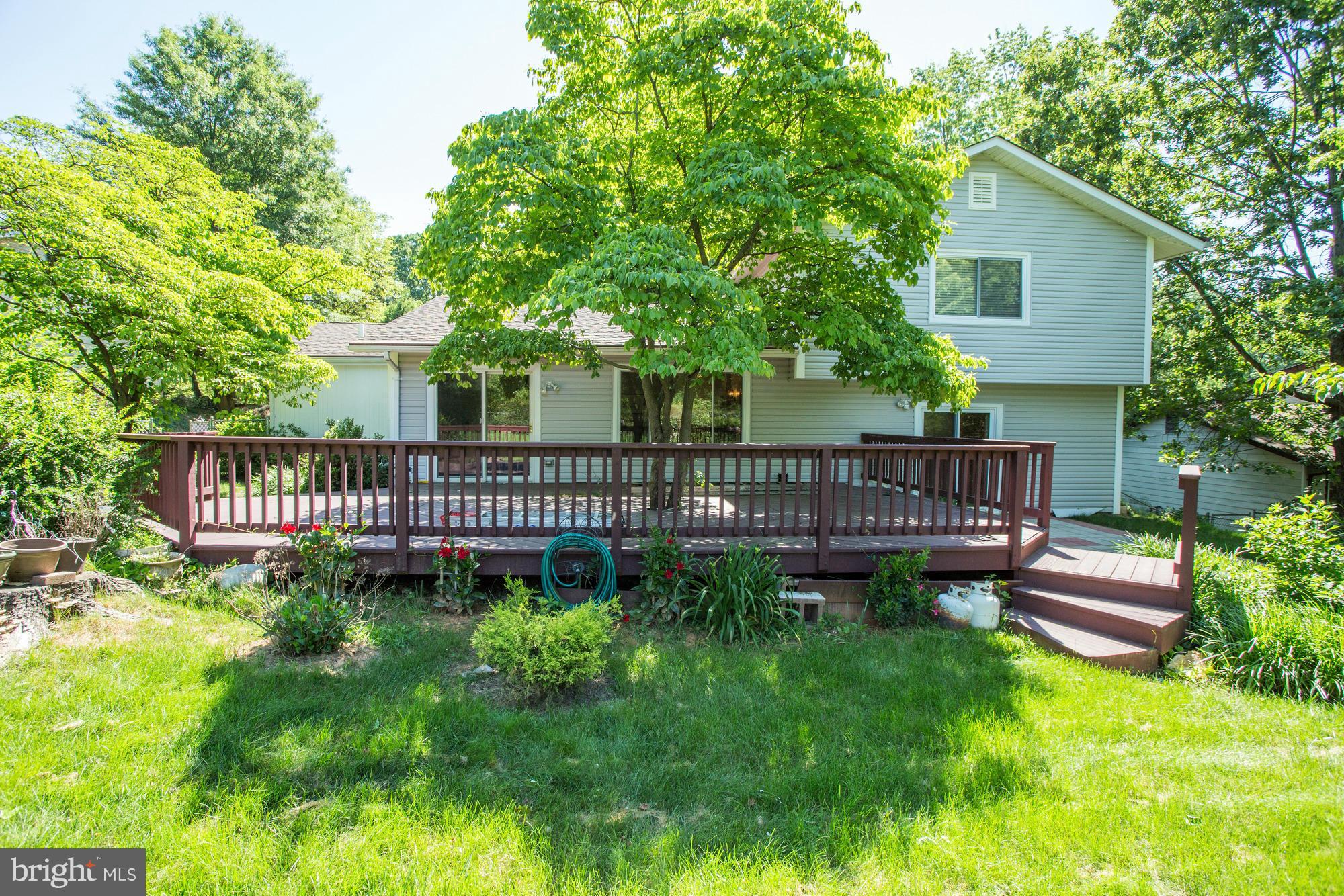 12906 Buccaneer Road Silver Spring, MD 20904 - Photo 29 of 30 a view of a house with a deck and a yard