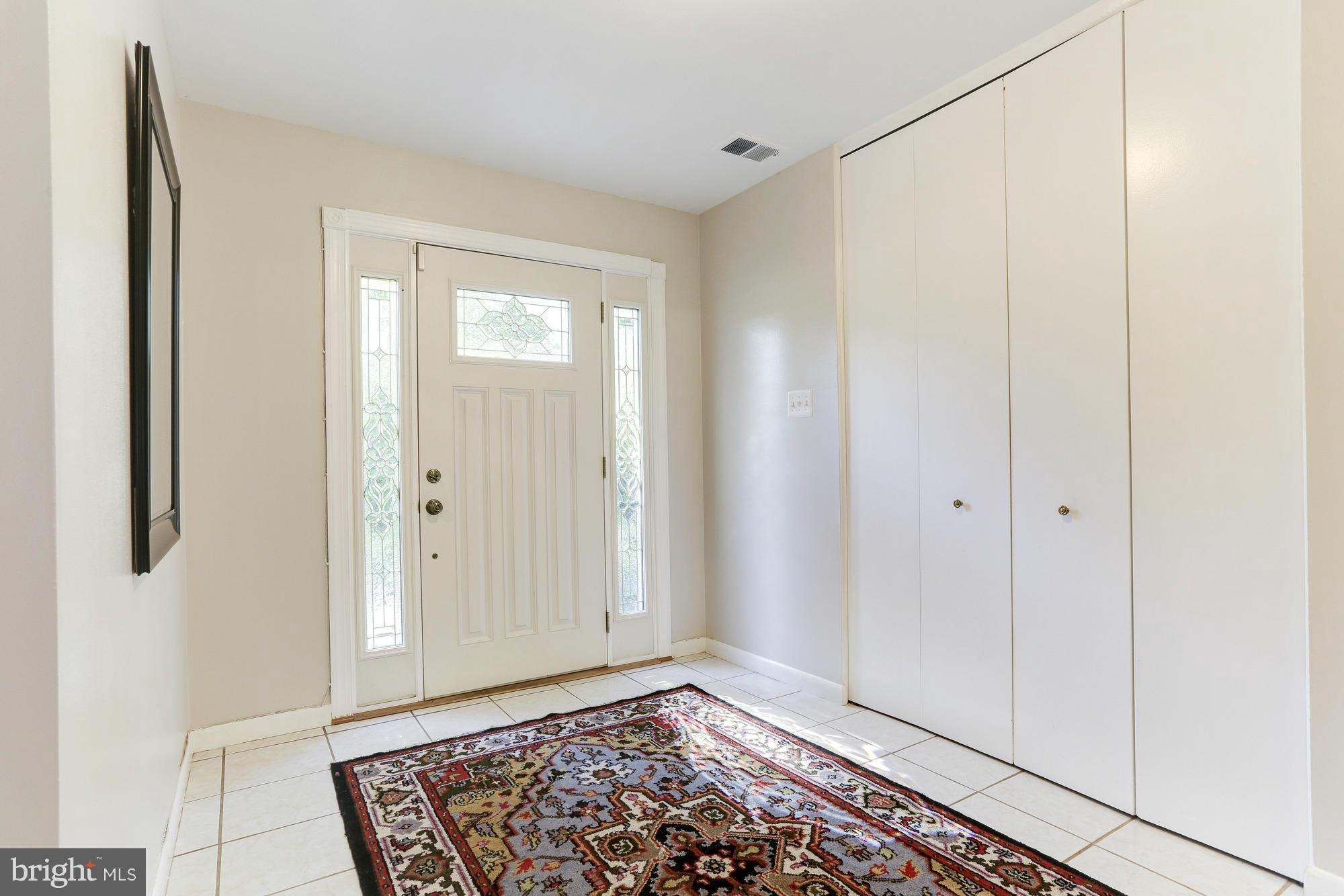 12906 Buccaneer Road Silver Spring, MD 20904 - Photo 5 of 30 a view of an empty room with window and wooden floor