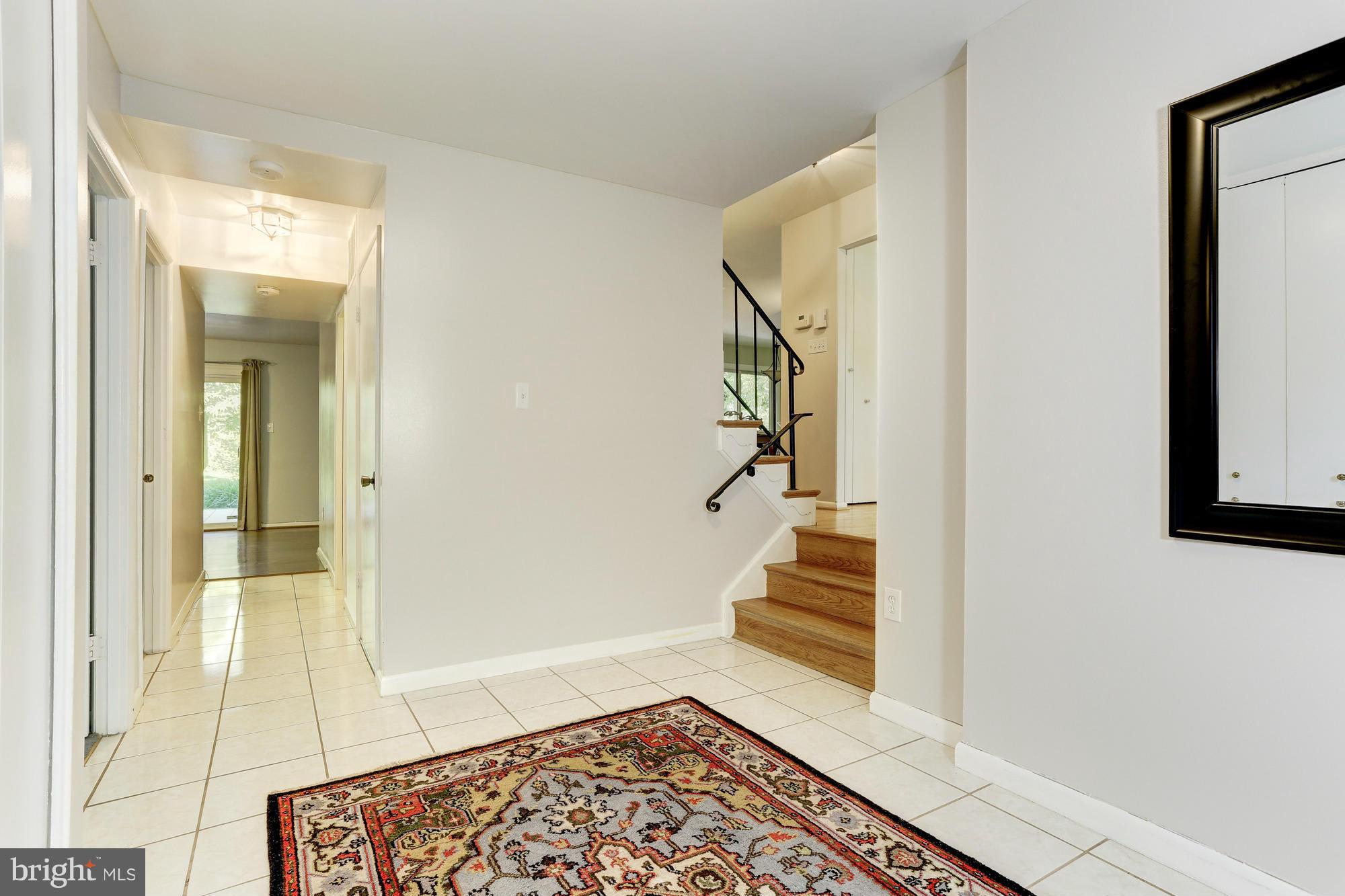 12906 Buccaneer Road Silver Spring, MD 20904 - Photo 6 of 30 a view of a hallway with wooden floor and staircase