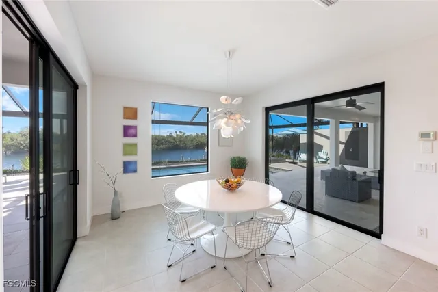a outdoor dining space with a table and chairs