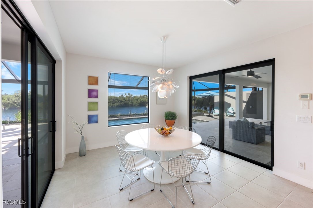 2906 Southwest 29th Terrace Cape Coral, FL 33914 - Photo 13 of 49 a outdoor dining space with a table and chairs