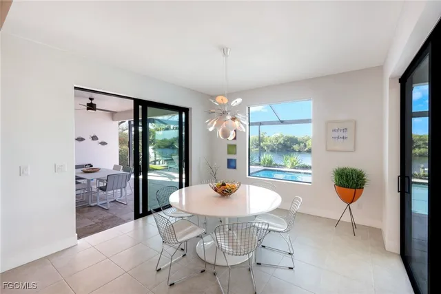 a living room with furniture a window and a table