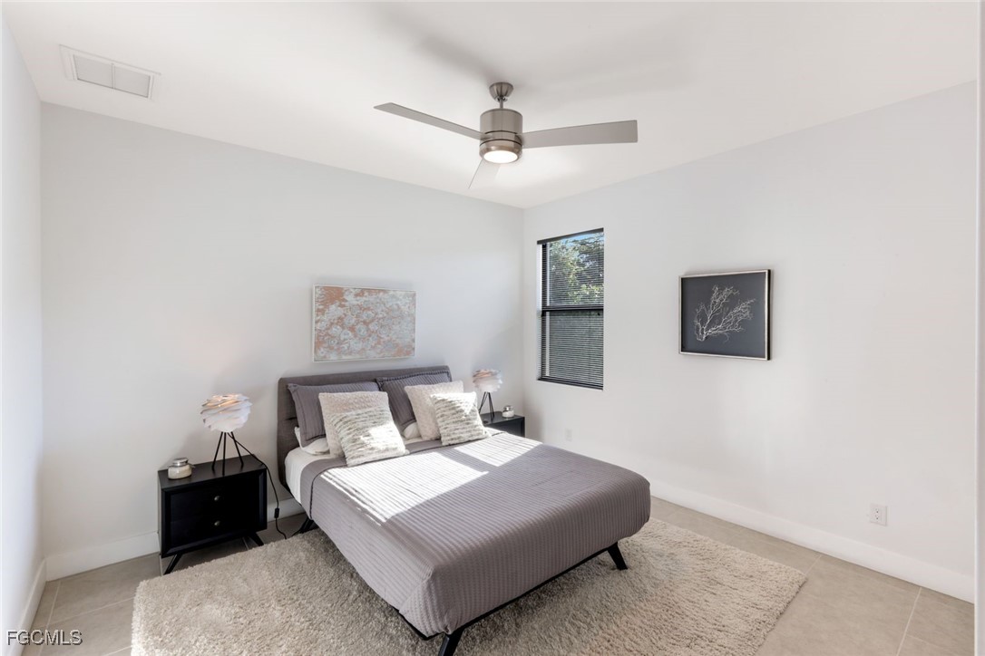 2906 Southwest 29th Terrace Cape Coral, FL 33914 - Photo 20 of 49 a bedroom with a bed and window