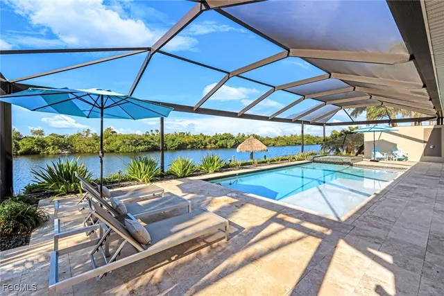a view of a swimming pool with a patio