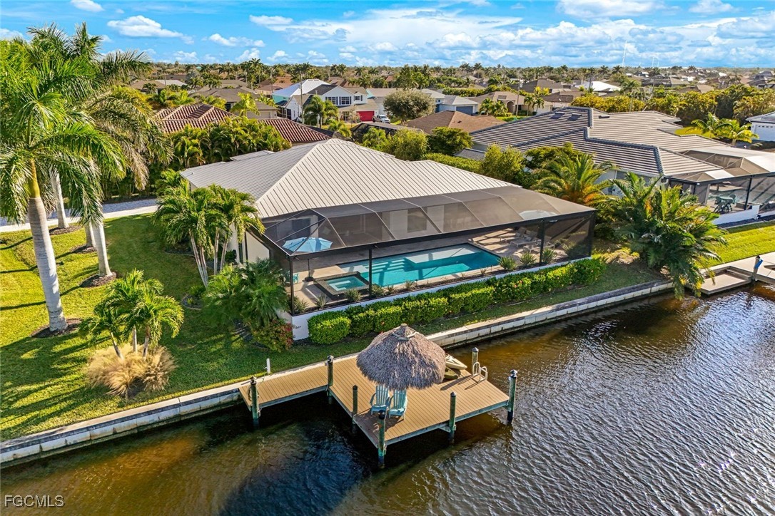 2906 Southwest 29th Terrace Cape Coral, FL 33914 - Photo 43 of 49 an aerial view of a house with a ocean view