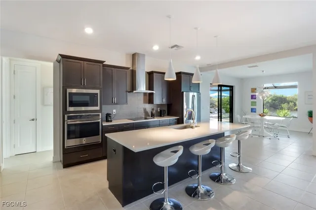 a kitchen with a table and chairs in it