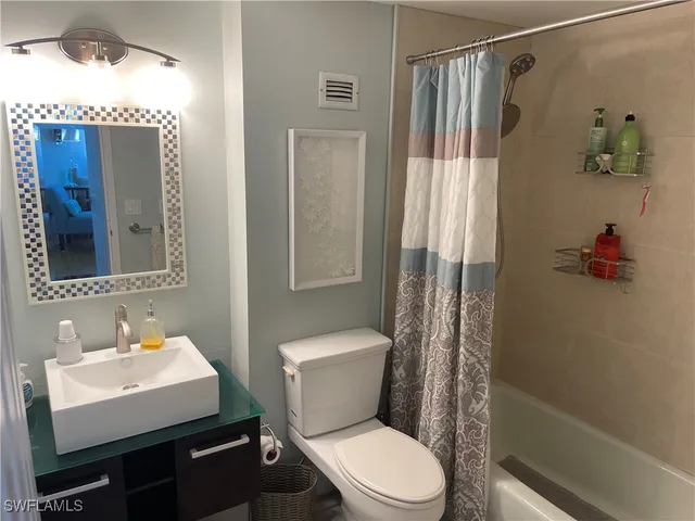 a kitchen with a sink stove and microwave