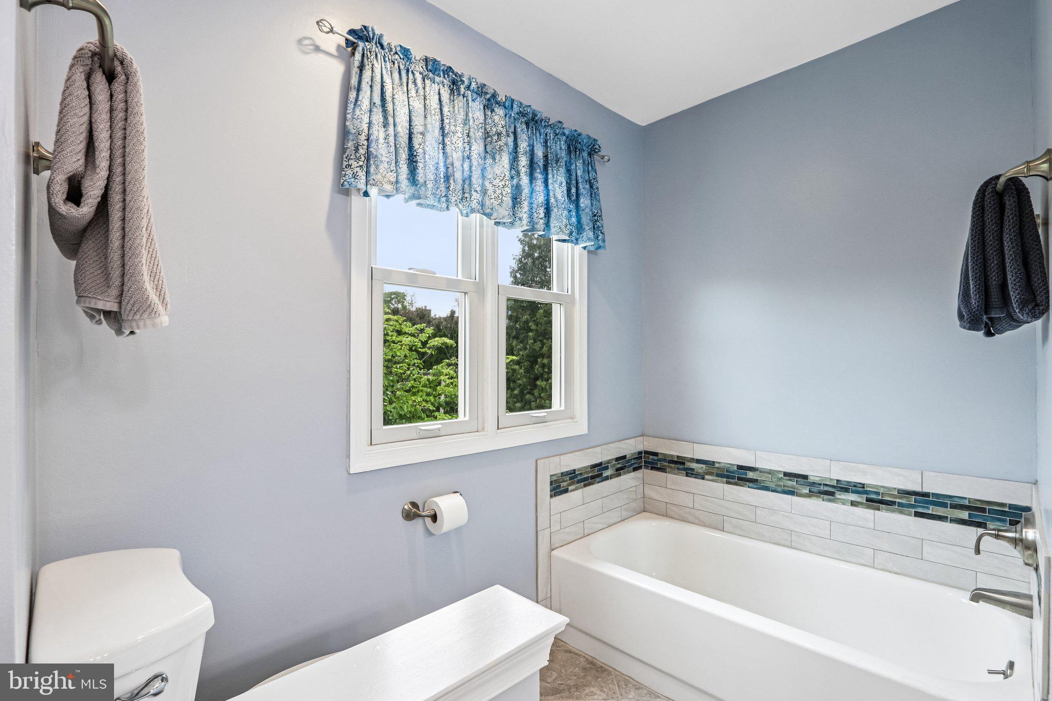 36 Independence Place, Unit 36 Chesterbrook, PA 19087 - Photo 21 of 55 a white bath tub sitting next to a toilet