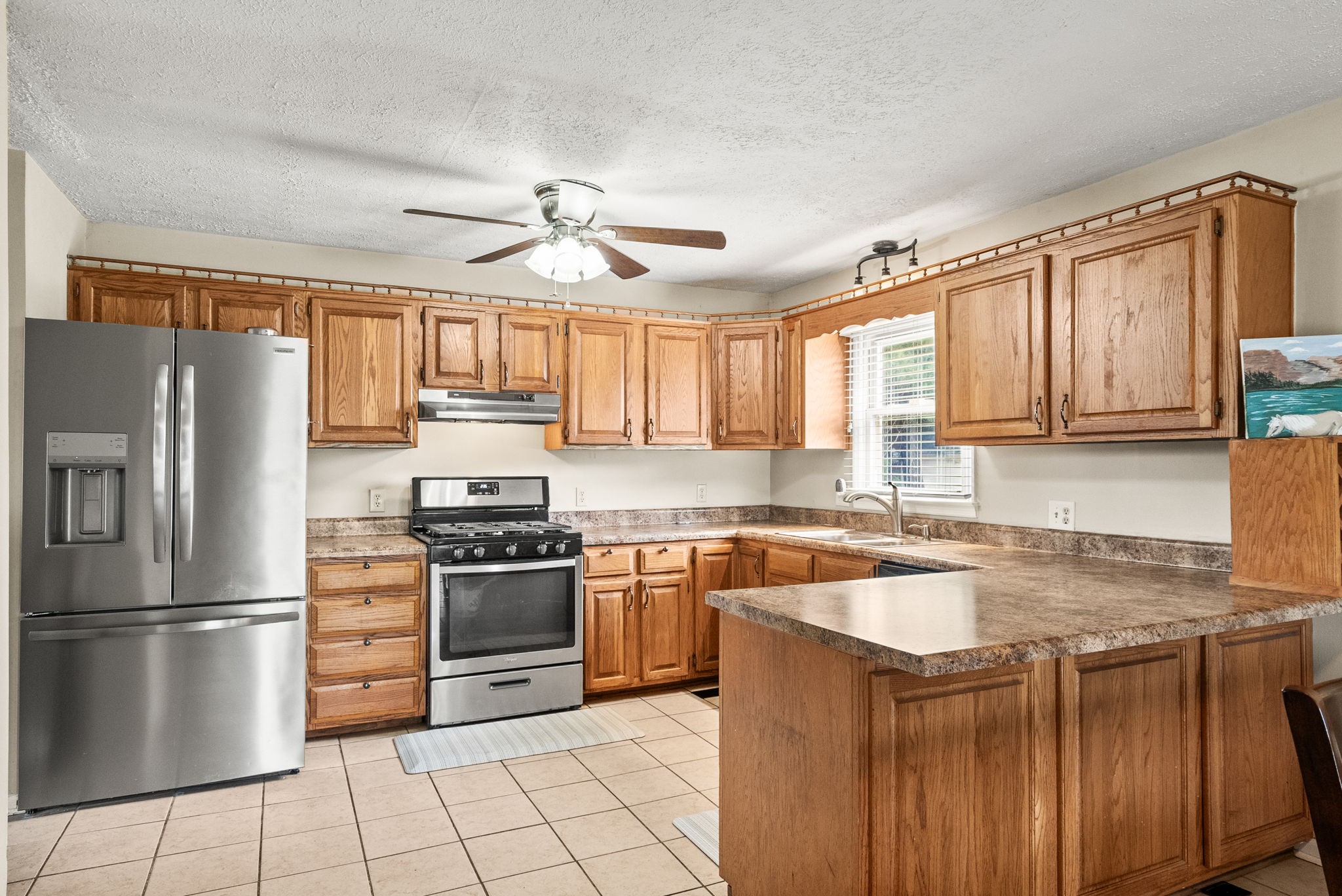 674 Lakeside Drive Springfield, TN 37172 - Photo 13 of 44 a kitchen with stainless steel appliances granite countertop a stove refrigerator sink and dishwasher