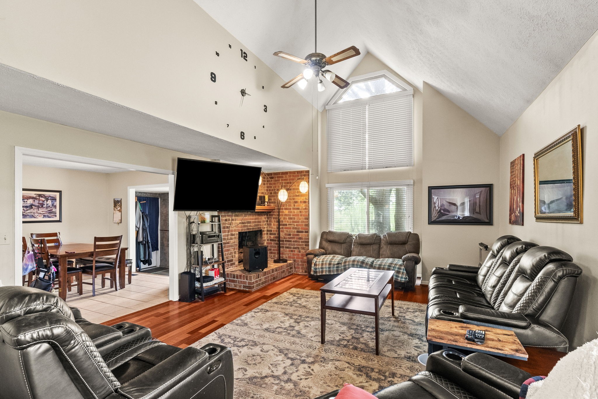 674 Lakeside Drive Springfield, TN 37172 - Photo 18 of 44 a living room with furniture a flat screen tv and a chandelier