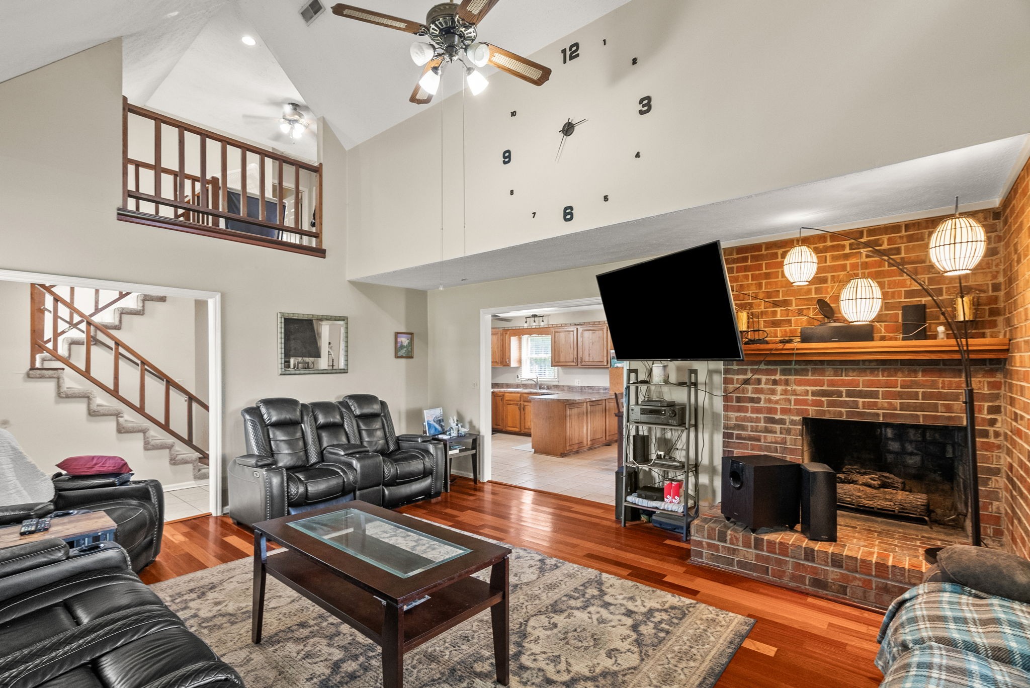 674 Lakeside Drive Springfield, TN 37172 - Photo 20 of 44 a living room with furniture a flat screen tv and a fireplace