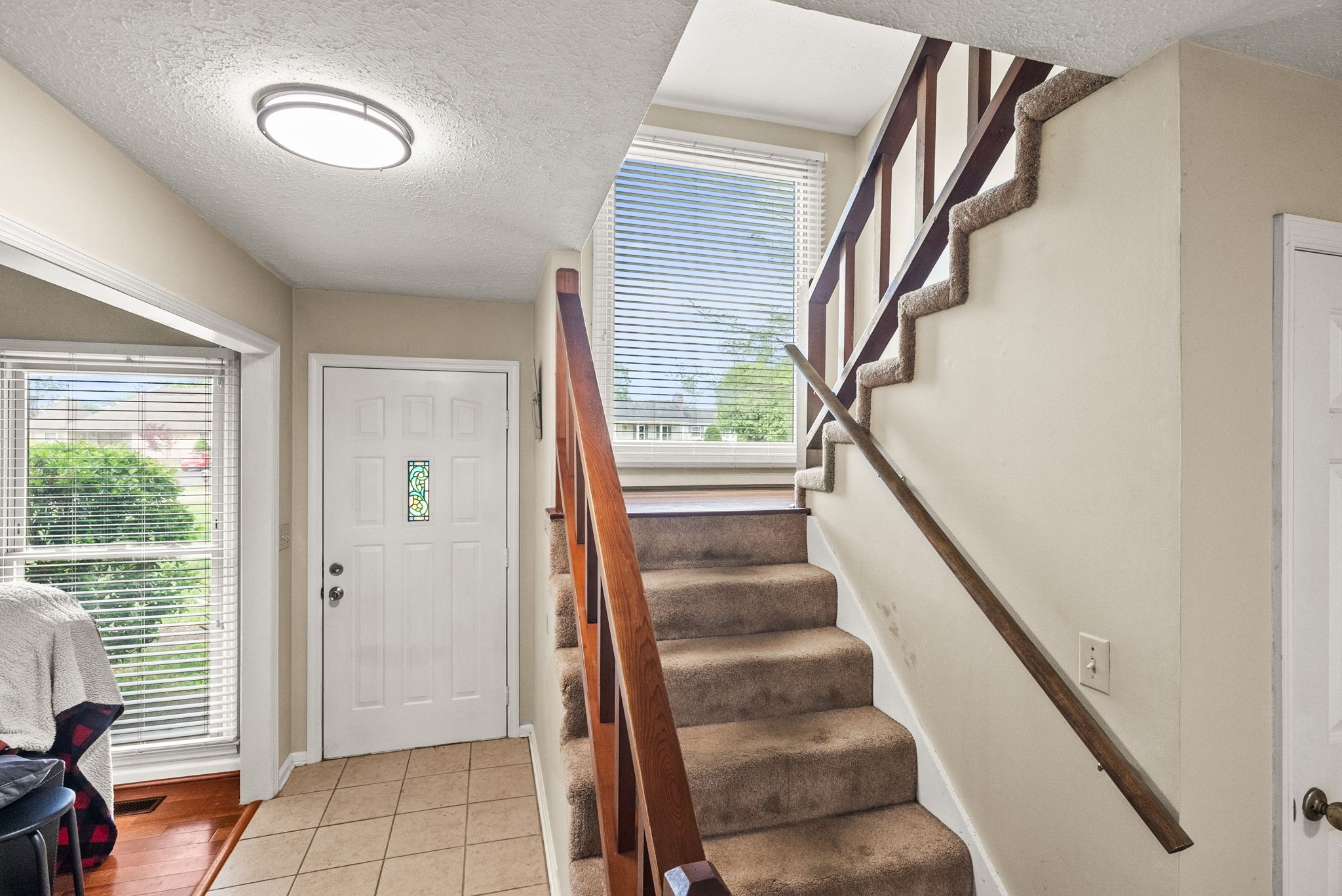 674 Lakeside Drive Springfield, TN 37172 - Photo 25 of 44 a view of staircase with lots of frames on wall and a window