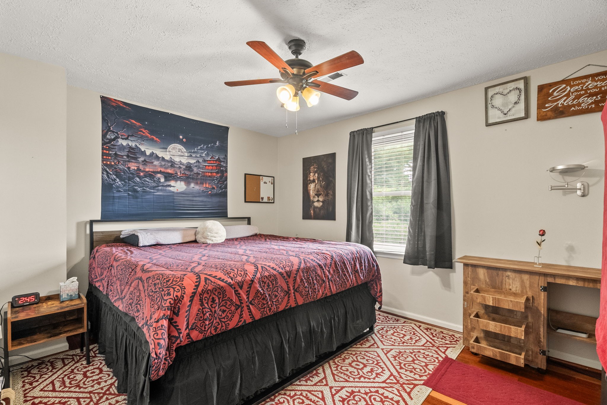 674 Lakeside Drive Springfield, TN 37172 - Photo 26 of 44 a bedroom with a bed and a chandelier