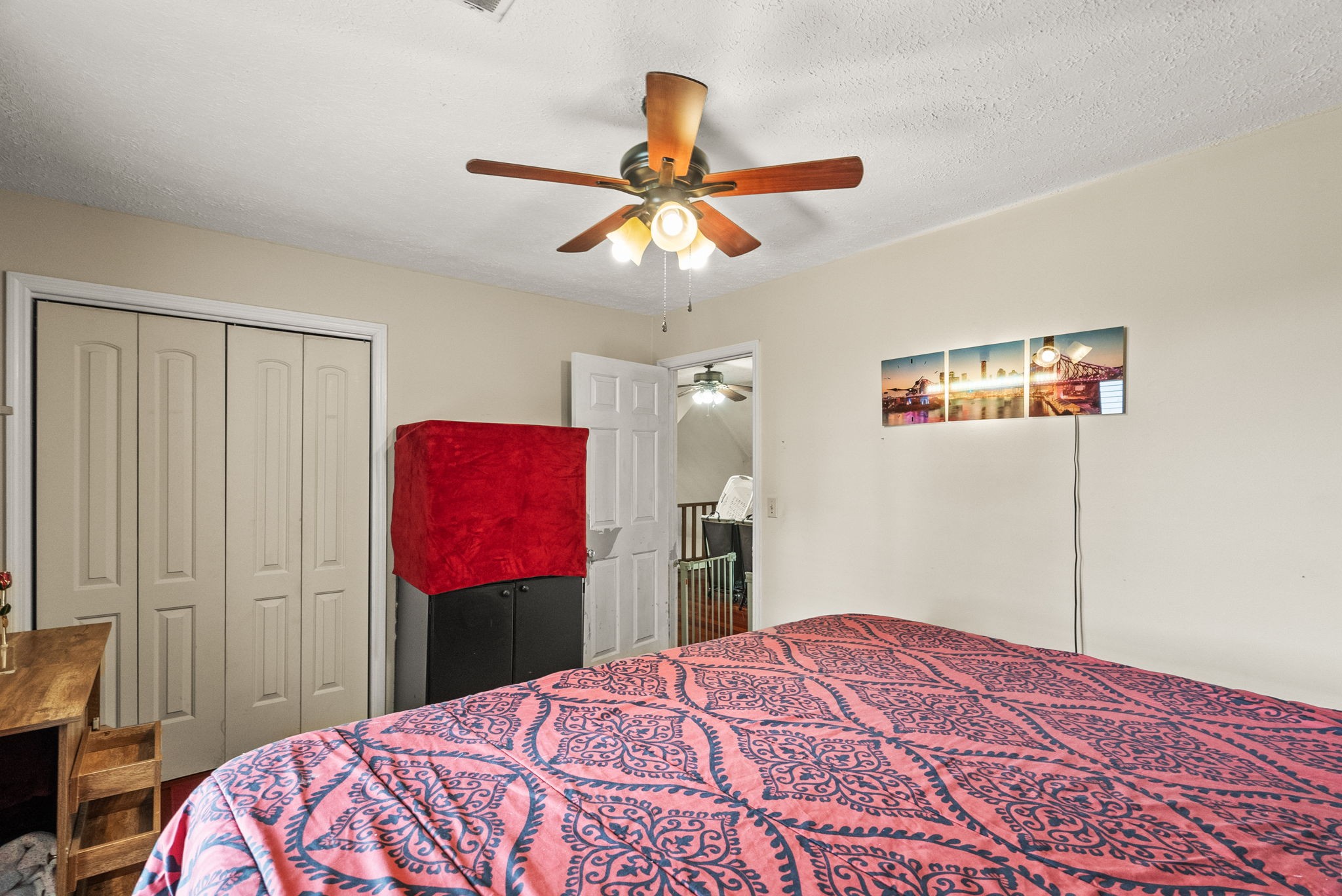 674 Lakeside Drive Springfield, TN 37172 - Photo 27 of 44 a bedroom with a bed and a chandelier