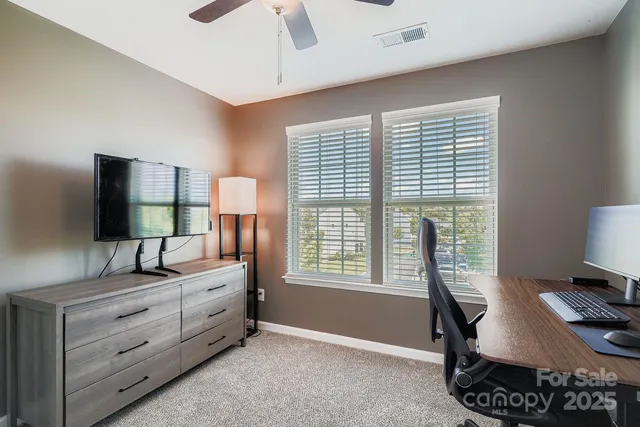 a bedroom with furniture and a window