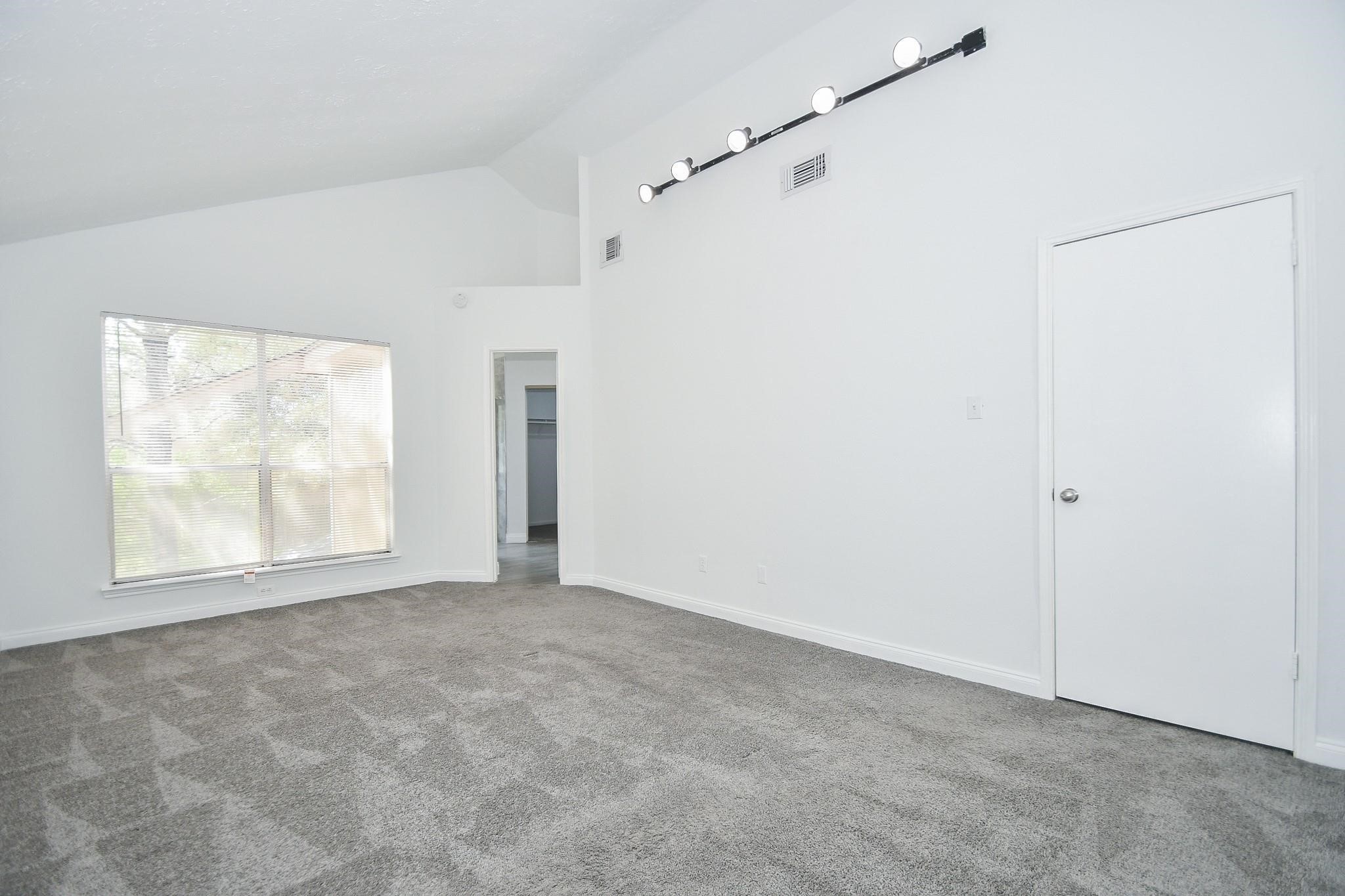 8803 Vinkins Road Houston, TX 77071 - Photo 3 of 9 a view of an empty room with a window