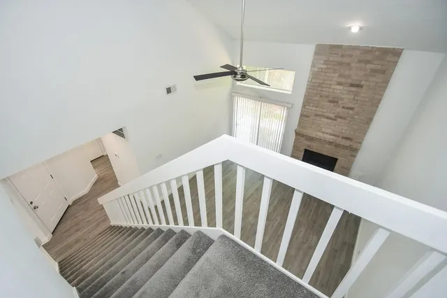 a view of a hallway with staircase