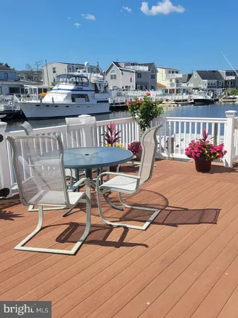 a view of outdoor space with deck and furniture