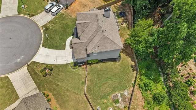 an aerial view of a house with swimming pool