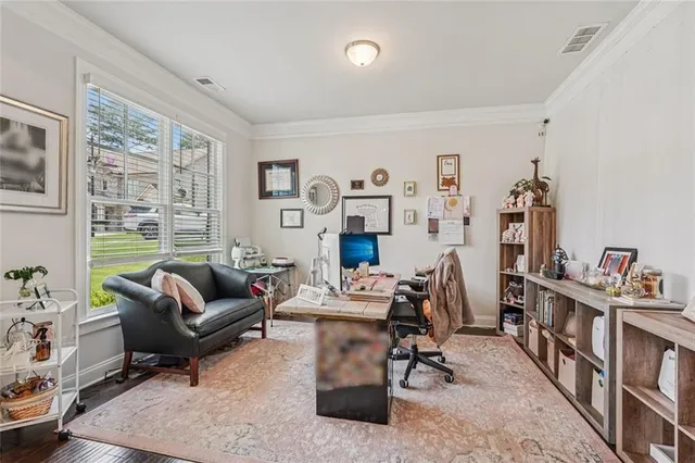 a living room with furniture rug and window