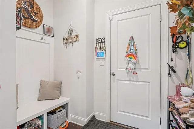 a bed room with a bed and a chair