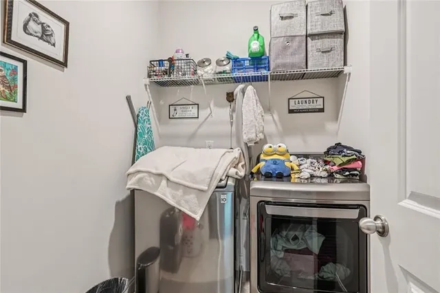 a bedroom with a bed and lamp