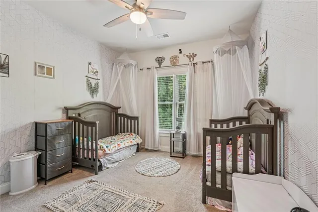 a bedroom with furniture and a window