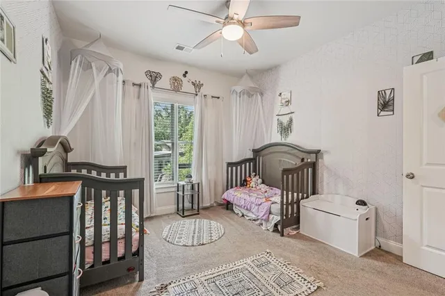 a bedroom with furniture and a window