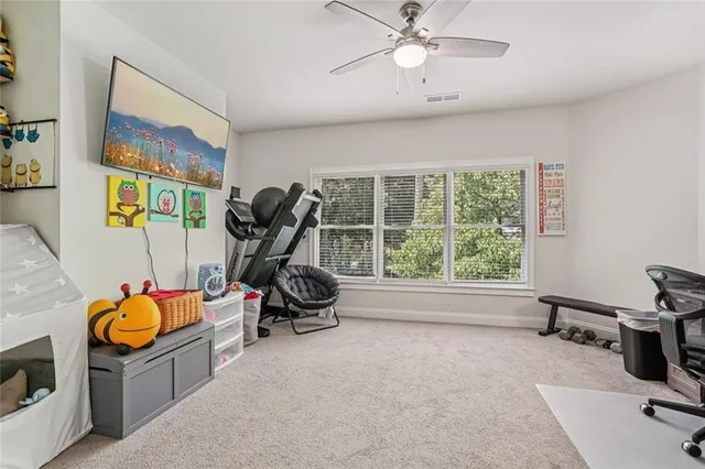 a bedroom with furniture and a large window
