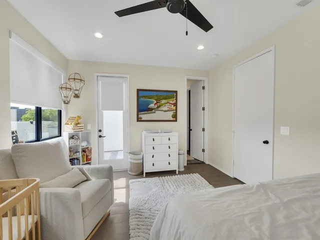 a bedroom with furniture and window